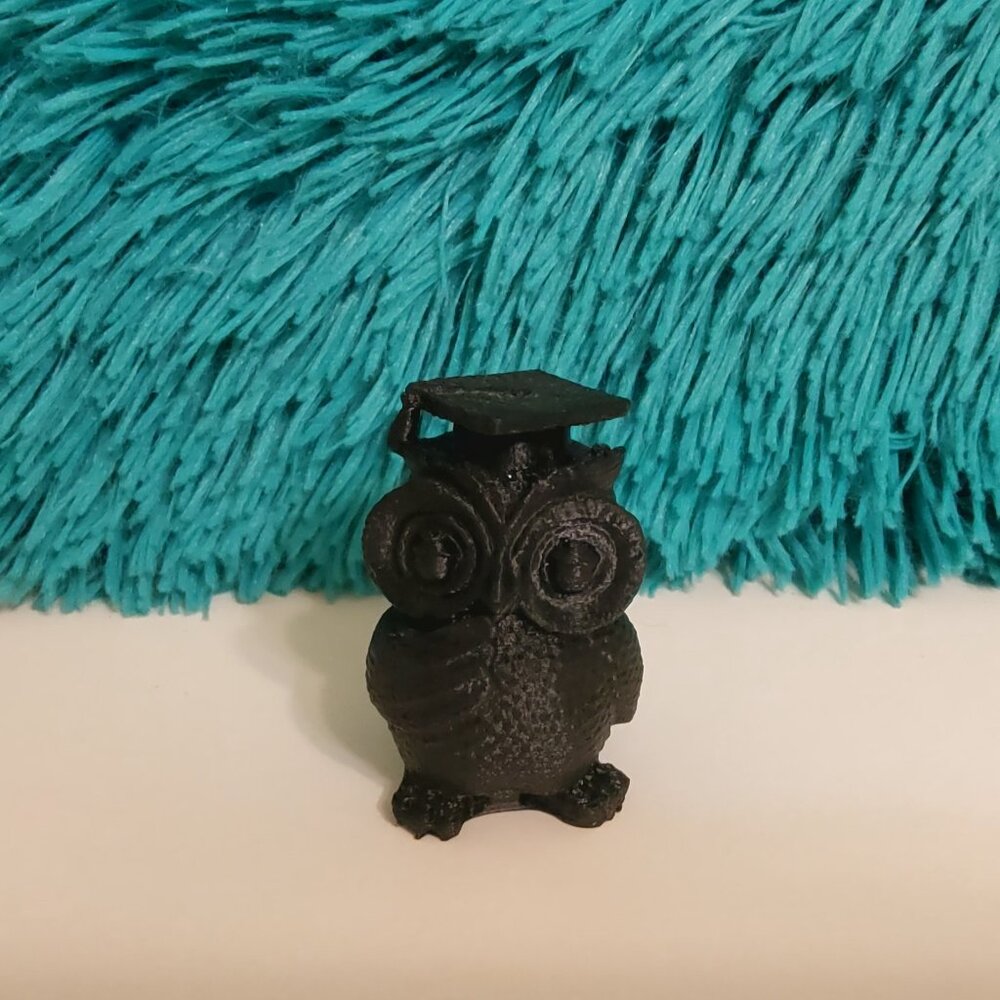 3D-printed owl figurine wearing a graduation cap